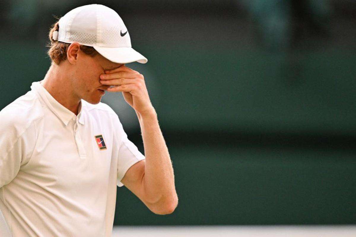 Italy's Jannik Sinner celebrates after victory against Spain's Carlos Alcaraz at the end of their men's singles final tennis match on the fourteenth day of the 2025 Wimbledon Championships at The All England Lawn Tennis and Croquet Club in Wimbledon, southwest London, on July 13, 2025. Kirill KUDRYAVTSEV / AFP