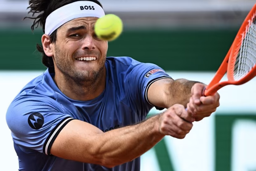 US Taylor Fritz plays a backhand return to US Nishesh Basavareddy during their men's singles match on day 1 of the French Open tennis tournament on Court Suzanne-Lenglen at the Roland-Garros Complex in Paris on May 24, 2026. JULIEN DE ROSA / AFP
