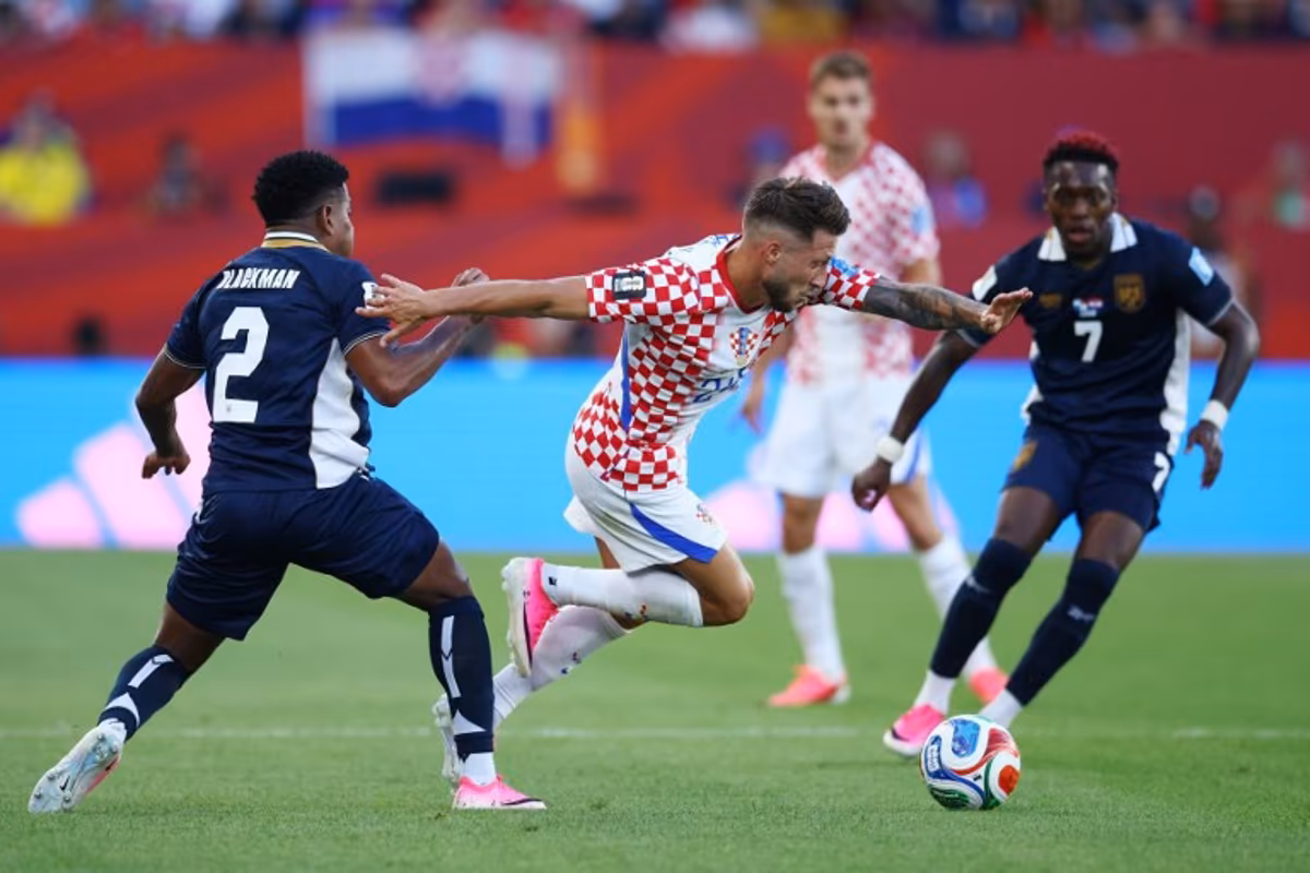 Croatia's forward #24 Marco Pasalic is fouled by Panama's defender #02 Cesar Blackman during the 2026 World Cup Group L football match between Panama and Croatia at the Toronto Stadium in Toronto on June 23, 2026. Cole Burston / AFP