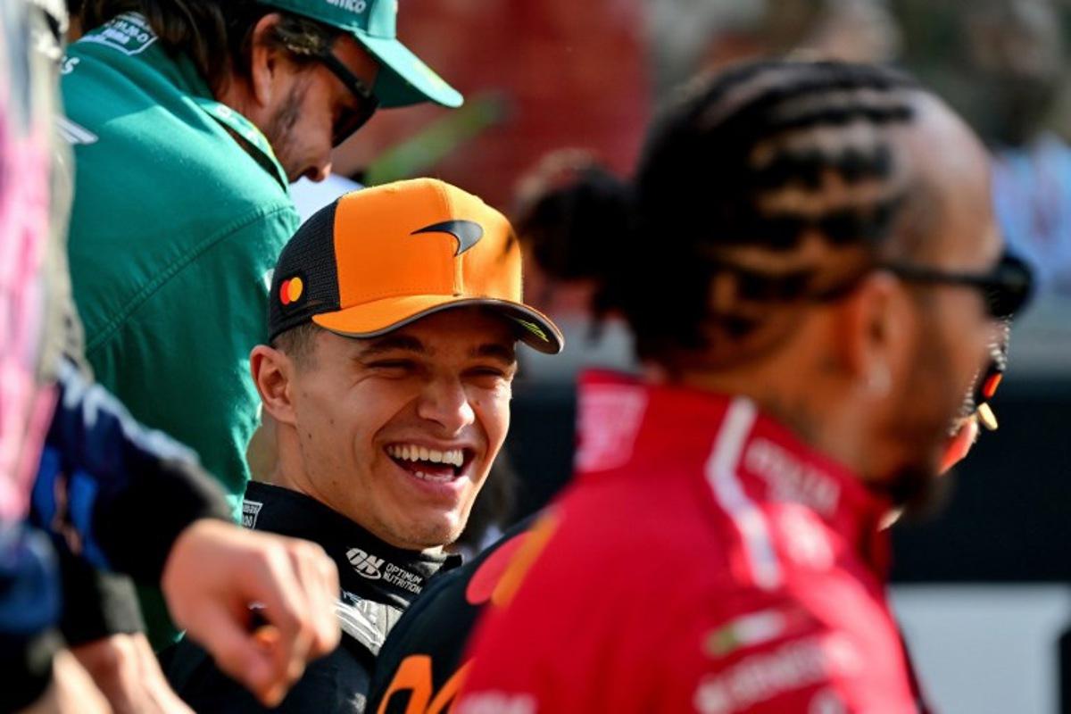Aston Martin's Spanish driver Fernando Alonso (top) McLaren's British driver Lando Norris (C) and Ferrari's British driver Lewis Hamilton (R) chat ahead of the Abu Dhabi Formula One Grand Prix at the Yas Marina Circuit in Abu Dhabi on December 7, 2025. Andrej ISAKOVIC / AFP