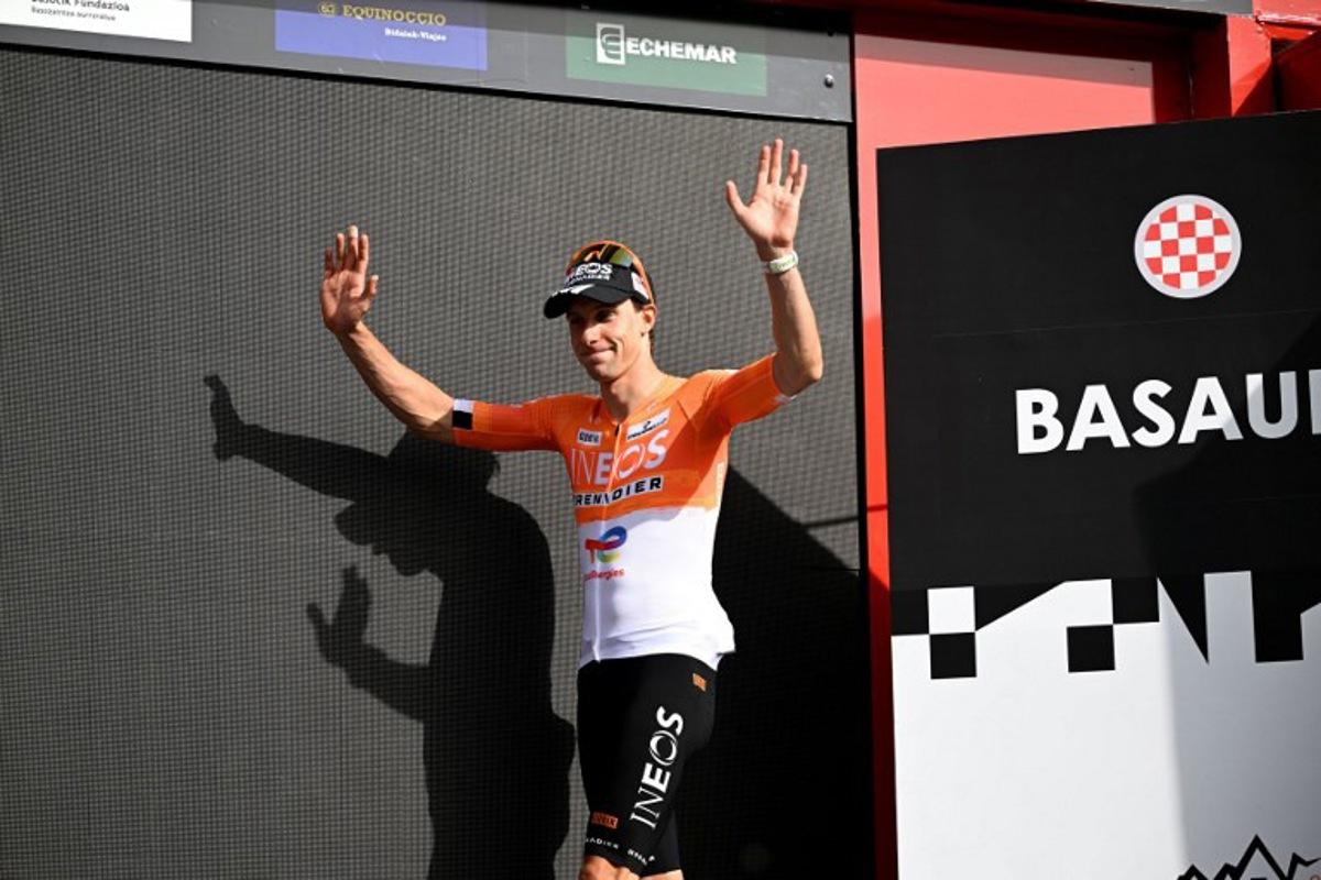 Team Ineos' French rider Axel Laurance celebrates on the podium winning the third stage ahead of Team UAE's Spanish rider Igor Arrieta during the Basque Country's Itzulia cycling tour, a 152.8 km race starting and finishing in Basauri, on April 8, 2026. ANDER GILLENEA / AFP