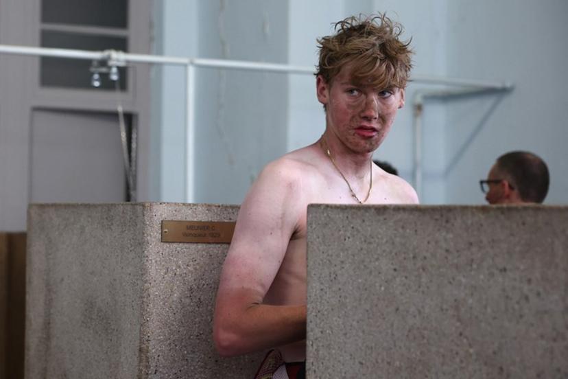 Modern Adventure Pro Cycling's US rider Ezra Caudell takes a shower at the end of the 123rd edition of the Paris-Roubaix one-day classic cycling race, 258.3 km between Compiègne and Roubaix, at the Vélodrome André-Pétrieux in Roubaix, northern France, on April 12, 2026. Anne-Christine POUJOULAT / AFP