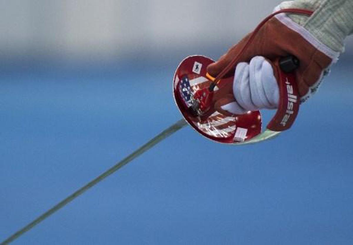 A US flag is seen on the weapon of US athlete Ibtihaj Muhammad during the Women's Team Sabre competition at the World Fencing Championships on July 25, 2017 in Leipzig, eastern Germany. ROBERT MICHAEL / AFP