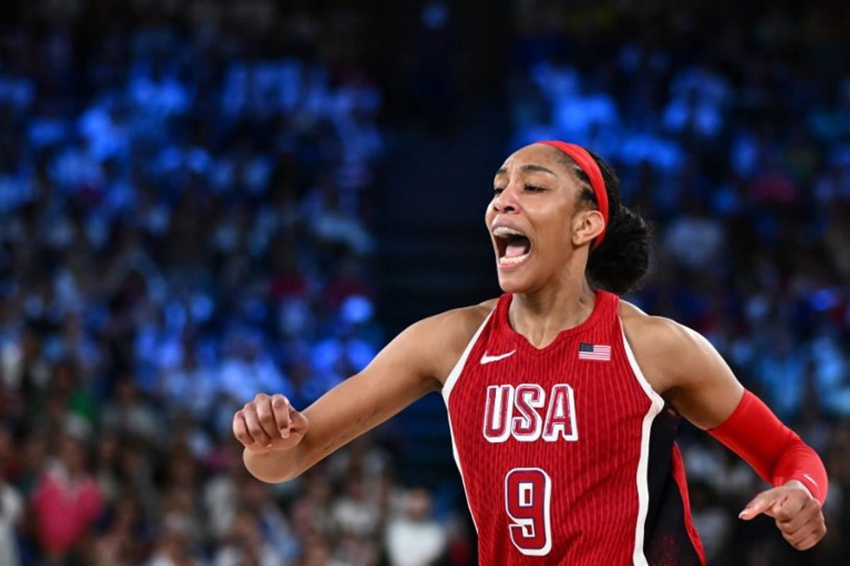 USA's #09 A'ja Wilson celebrates after scoring in the women's Gold Medal basketball match between France and the USA during the Paris 2024 Olympic Games at the Bercy Arena in Paris on August 11, 2024. Aris MESSINIS / AFP