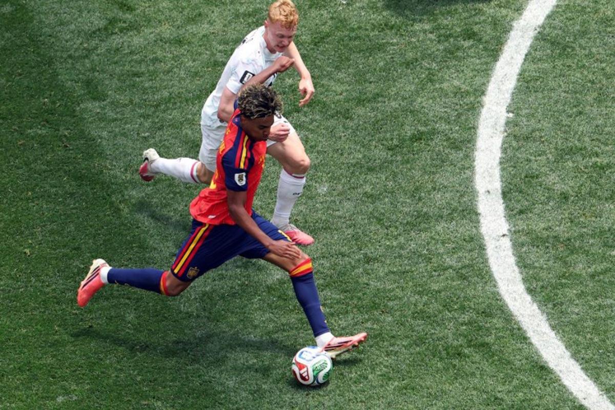 Spain's forward #19 Lamine Yamal (bottom) kicks the ball past Austria's midfielder #06 Nicolas Seiwald during the 2026 World Cup round of 32 football match between Spain and Austria at the Los Angeles Stadium in Inglewood on July 2, 2026. VALERIE MACON / AFP