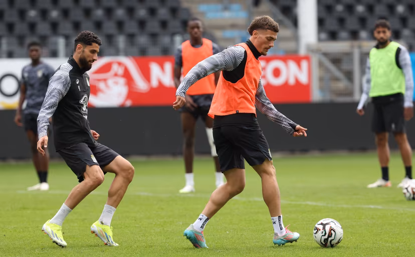 Charleroi's Aiham Ousou and Charleroi's Anthony Descotte fight for the ball during a training session of Belgian soccer team Sporting Charleroi, on Wednesday 30 July 2025 in Charleroi. The team is preparing for tomorrow's game against Swedish Hammarby Fotboll, the return leg of the 2nd qualifying round for the UEFA Conference League competition. The first leg resulted in a 0-0 draw. BELGA PHOTO VIRGINIE LEFOUR