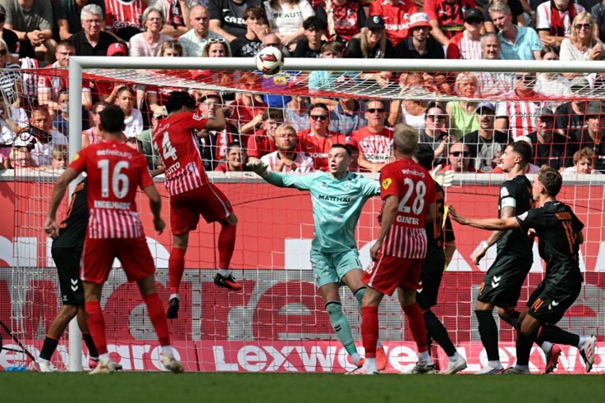 Freiburg's Japanese midfielder #14 Yuito Suzuki scores the team's first goal during the German first division Bundesliga football match between SC Freiburg and Werder Bremen in Freiburg, southern Germany, on August 30, 2026. THOMAS KIENZLE / AFP
