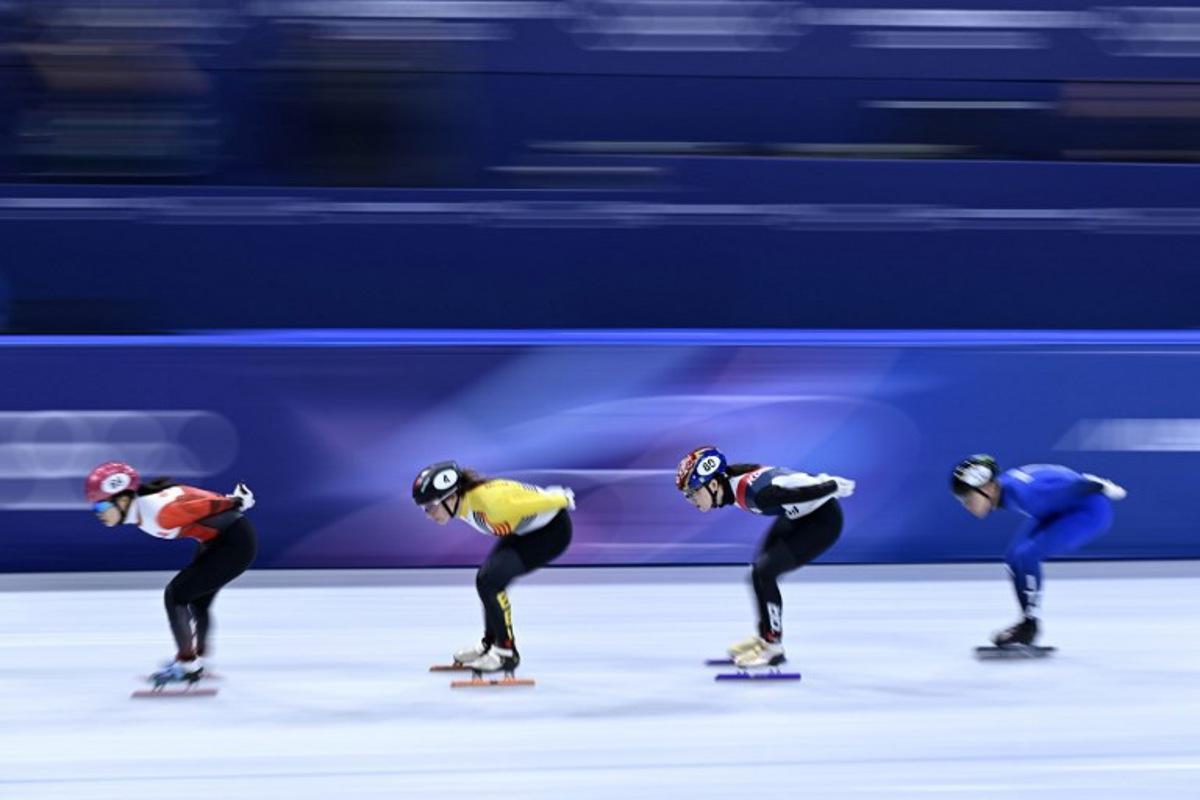 (L-R) Hong Kong's Lam Ching Yan, Belgium's Hanne Desmet, South Korea's Noh Do-hee and Italy's Arianna Fontana compete in the short track speed skating women's 1500m quarter-final during the Milano Cortina 2026 Winter Olympic Games at Milano Ice Skating Arena in Milan on February 20, 2026. WANG Zhao / AFP
