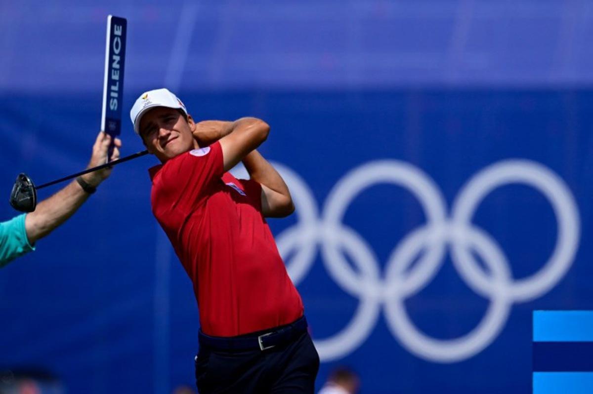 Belgium's Adrien Dumont de Chassart tees off in round 2 of the men's golf individual stroke play of the Paris 2024 Olympic Games at Le Golf National in Guyancourt, south-west of Paris on August 2, 2024. John MACDOUGALL / AFP