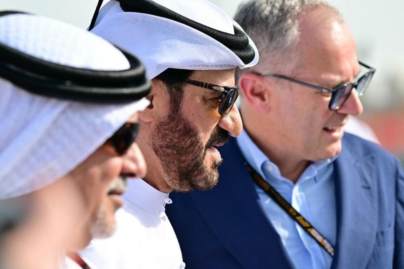 Formula One CEO Stefano Domenicali (R), FIA president Mohammed Ben Sulayem (C) and Bahrain Crown Prince Salman bin Hamad Al Khalifa pose ahead of the Bahrain Formula One Grand Prix at the Bahrain International Circuit in Sakhir on April 13, 2025. Giuseppe CACACE / AFP