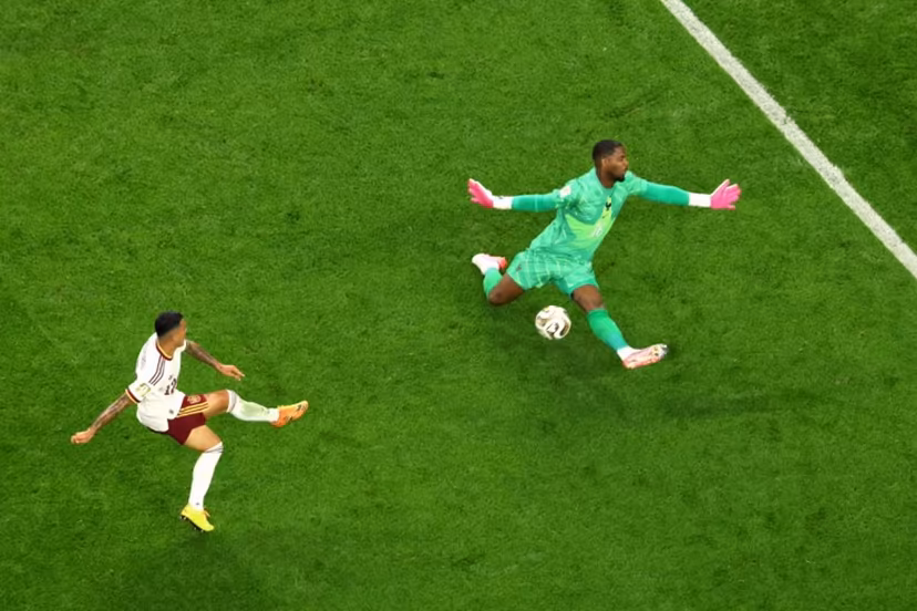 Spain's defender #12 Pedro Porro scores his team's second goal past France's goalkeeper #16 Mike Maignan during the 2026 World Cup football tournament semi-final match between France and Spain at the Dallas Stadium in Arlington on July 14, 2026. Odd ANDERSEN / AFP
