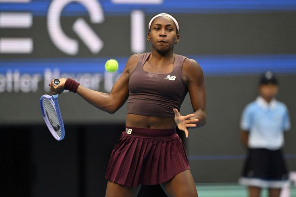 USA's Coco Gauff hits a return to Belgium's Elise Mertens during their women's singles match at the China Open tennis tournament in Beijing on October 7, 2026. Adek BERRY / AFP
