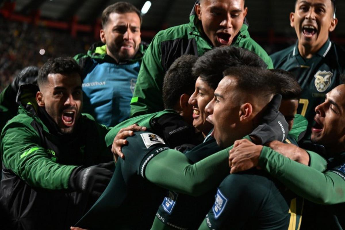 Bolivia's forward #07 Miguel Terceros (C) celebrates with his teammates after scoring his team's first goal during the 2026 FIFA World Cup South American qualifiers football match between Bolivia and Brazil, at the Municipal de El Alto stadium, in El Alto, La Paz department, Bolivia on September 9, 2025. AIZAR RALDES / AFP