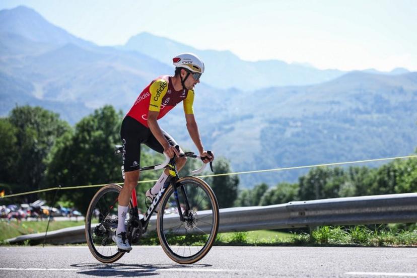 Cofidis team's German rider Emanuel Buchmann cycles during the 13th stage of the 112th edition of the Tour de France cycling race, 10.9 km individual time trial between Loudenvielle and Peyragudes, in the Pyrenees mountains of southwestern France, on July 18, 2025. Anne-Christine POUJOULAT / AFP