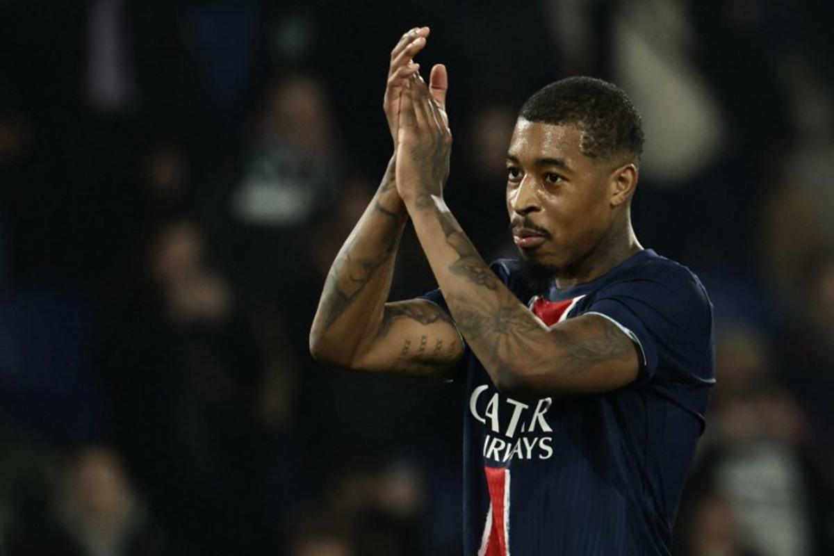 Paris Saint-Germain's French defender #03 Presnel Kimpembe celebrates PSG's victory at the end of the UEFA Champions League knockout phase play-off 2nd leg football match between Paris Saint-Germain (FRA) and Brest (FRA) at the Parc des Princes stadium in Paris on February 19, 2025. Thibaud MORITZ / AFP