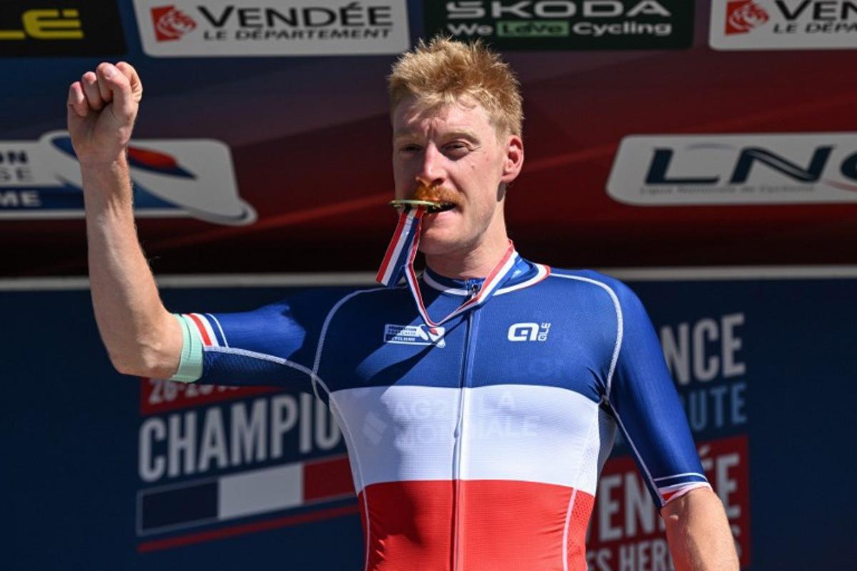 Decathlon-AG2R La Mondiale's French rider Dorian Godon poses with his medal after winning the men's Elite race of the French National Road Cycling championships, in Les Herbiers, western France, on June 29, 2025. Sebastien Salom-Gomis / AFP