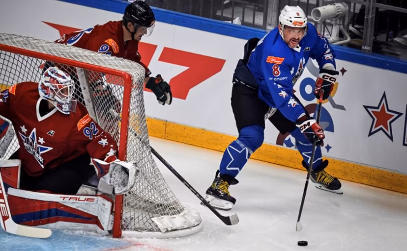 NHL's Russian Alexander Ovechkin (R) attacks the net of KHL's Daniil Isayev during the charity hockey "Match of the Year" between Russian players of the National Hockey League (NHL) and the Kontinental Hockey League (KHL) at the CSKA arena in Moscow on July 13, 2025. Alexander NEMENOV / AFP