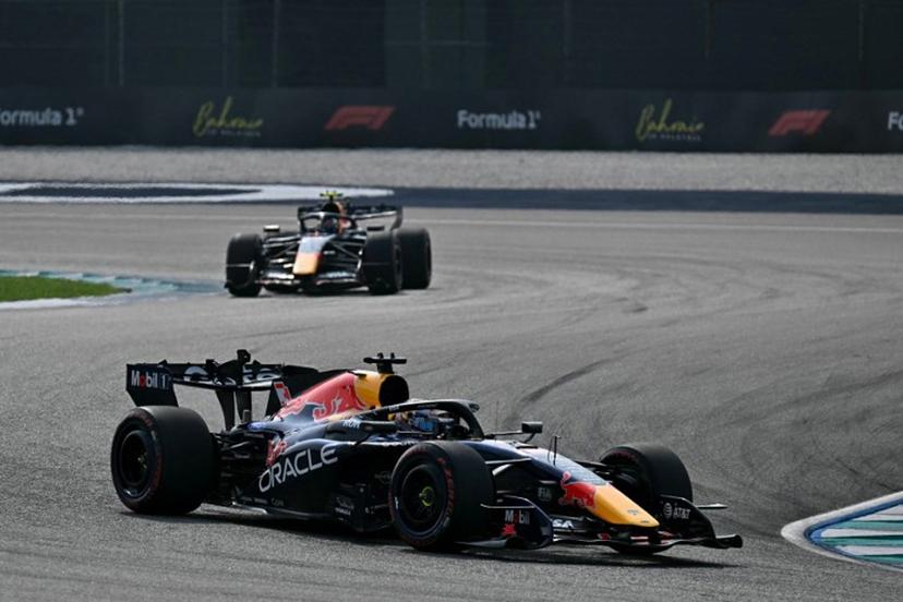 Red Bull Racing's Dutch driver Max Verstappen (front) and Red Bull Racing's French driver Isack Hadjar drive during the qualifying session of the Formula One Bahrain Grand Prix in Sepang on October 3, 2026. Lillian SUWANRUMPHA / AFP