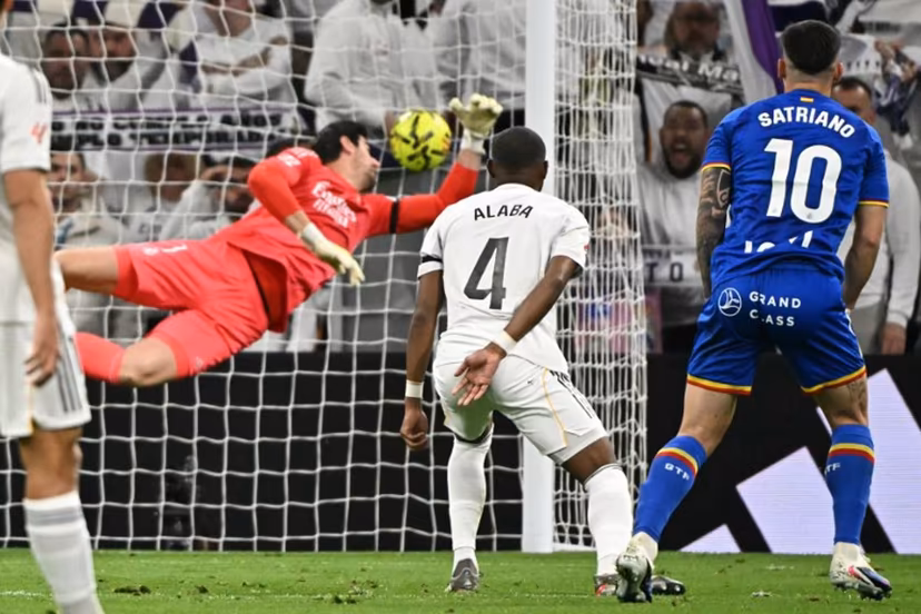Getafe's Uruguayan forward #10 Martín Satriano scores the opening goal during the Spanish league football match between Real Madrid CF and Getafe CF at Santiago Bernabeu Stadium in Madrid on March 2, 2026. Javier SORIANO / AFP