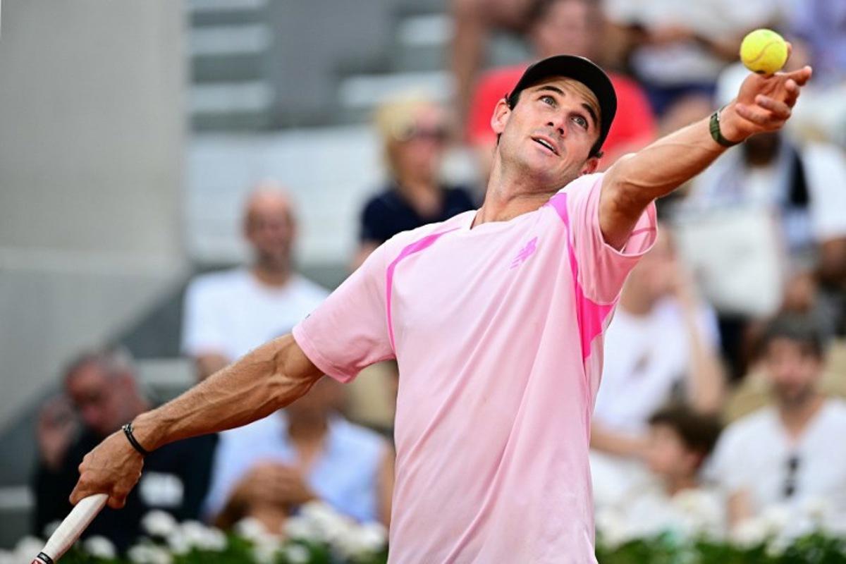 US Tommy Paul serves to Norway's Casper Ruud during their men's singles match on day 6 of the French Open tennis tournament on Court Suzanne-Lenglen at the Roland-Garros Complex in Paris on May 29, 2026. JULIEN DE ROSA / AFP