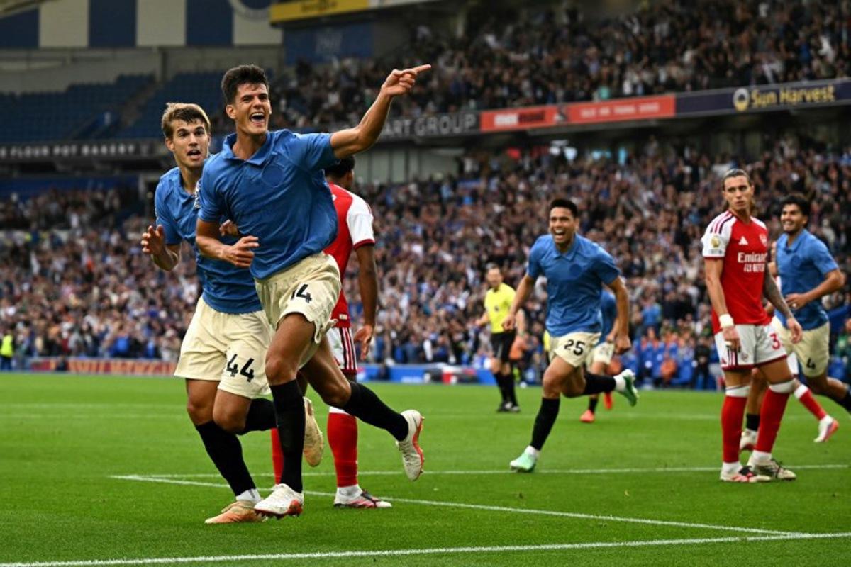 Brighton's Spanish midfielder #14 Chema Andrés celebrates scoring the team's third goal during the English Premier League football match between Brighton and Hove Albion and Arsenal at the American Express Community Stadium in Brighton, southern England on September 19, 2026. Glyn KIRK / AFP