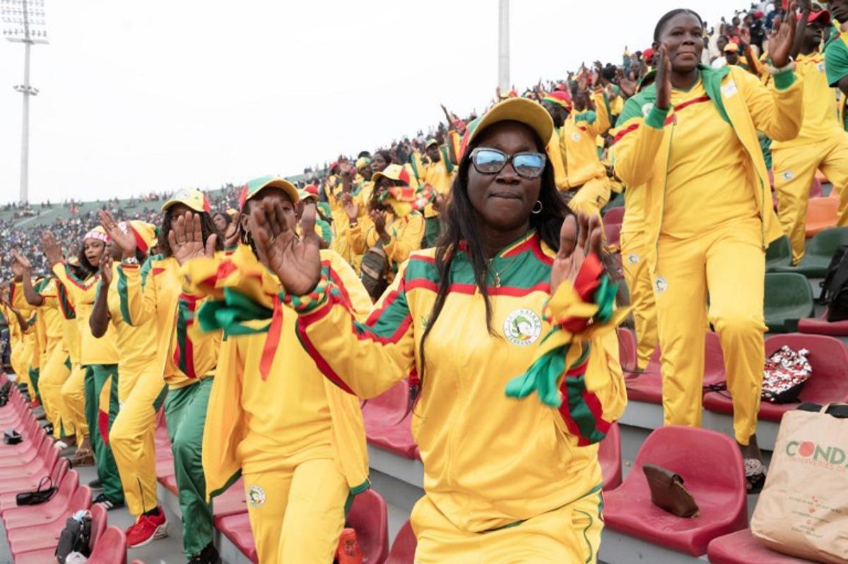 Lions of Senegal's supporters cheer during the Senegal's national football team last training session prior to the start of the 2025 Africa Cup of Nations hosted by Morocco, at the Leopaul Sedar Senghor stadium, in Dakar on December 18, 2025. SEYLLOU / AFP