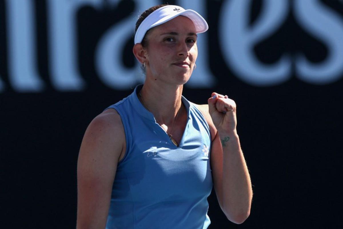 Belgium's Elise Mertens celebrates beating Japan's Moyuka Uchijima in their women's singles match on day five of the Australian Open tennis tournament in Melbourne on January 22, 2026. IZHAR KHAN / AFP