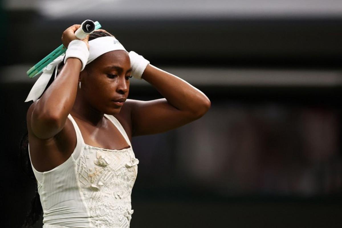 US player Coco Gauff reacts as she plays against Ukraine's Dayana Yastremska during their women's singles first round tennis match on the second day of the 2025 Wimbledon Championships at The All England Lawn Tennis and Croquet Club in Wimbledon, southwest London, on July 1, 2025. HENRY NICHOLLS / AFP