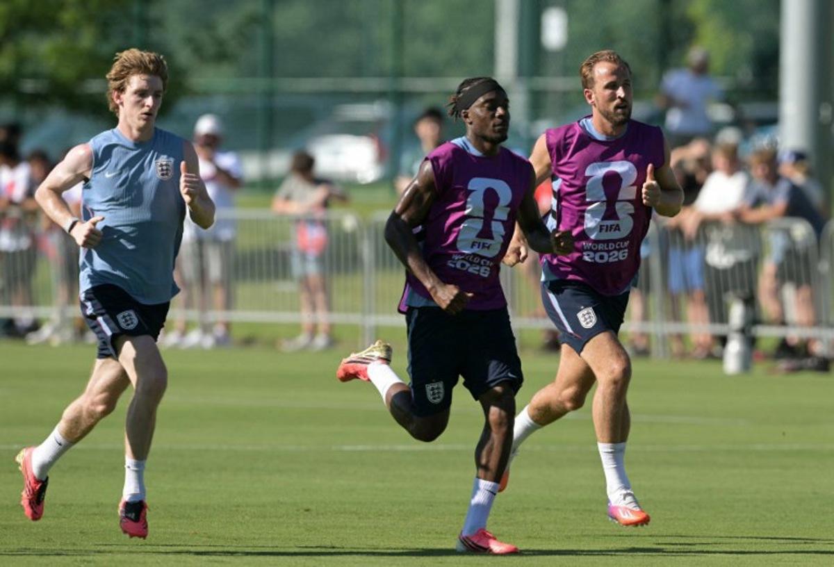 (From L) England's forward #18 Anthony Gordon, England's forward #20 Noni Madueke and England's forward #09 Harry Kane take part in a training session ahead of England's 2026 World Cup football tournament Group L football match against Croatia at Swope Soccer Village in Kansas City on June 13, 2026. JUAN MABROMATA / AFP