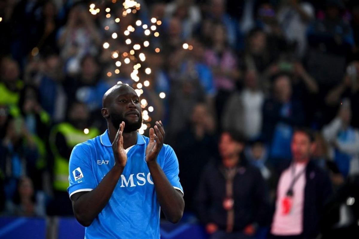 Napoli's Belgian forward #11 Romelu Lukaku applauds ahead of the trophy ceremony for the Italian Champions following the Italian Serie A football match between Napoli and Cagliari at the Diego Armando Maradona stadium in Naples on May 23, 2025. Isabella BONOTTO / AFP