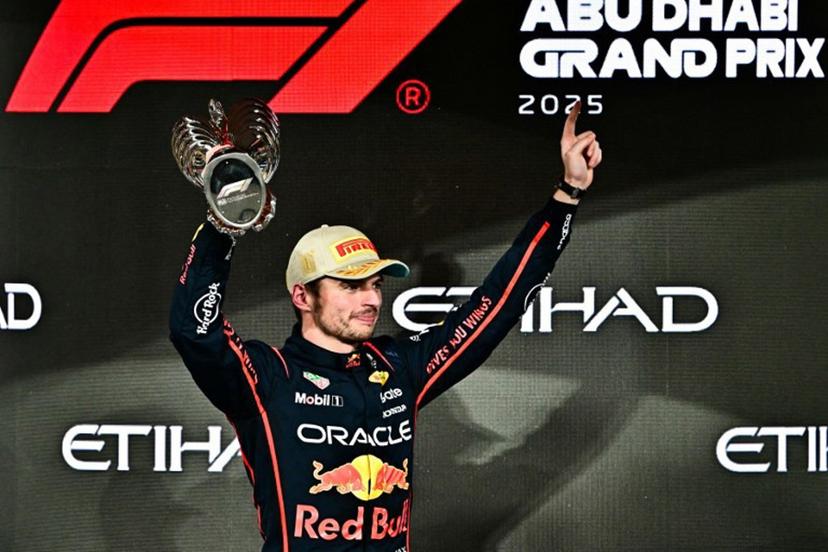 Race winner Red Bull Racing's Dutch driver Max Verstappen celebrates on the podium at the end of the Abu Dhabi Formula One Grand Prix at the Yas Marina Circuit in Abu Dhabi on December 7, 2025. Giuseppe CACACE / AFP