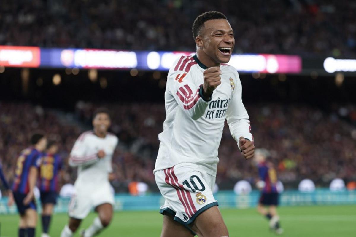 Real Madrid's French forward #10 Kylian Mbappe celebrates scoring his team's first goal during the Spanish league football match between FC Barcelona and Real Madrid CF at Camp Nou Stadium in Barcelona on October 25, 2026. Lluis GENE / AFP