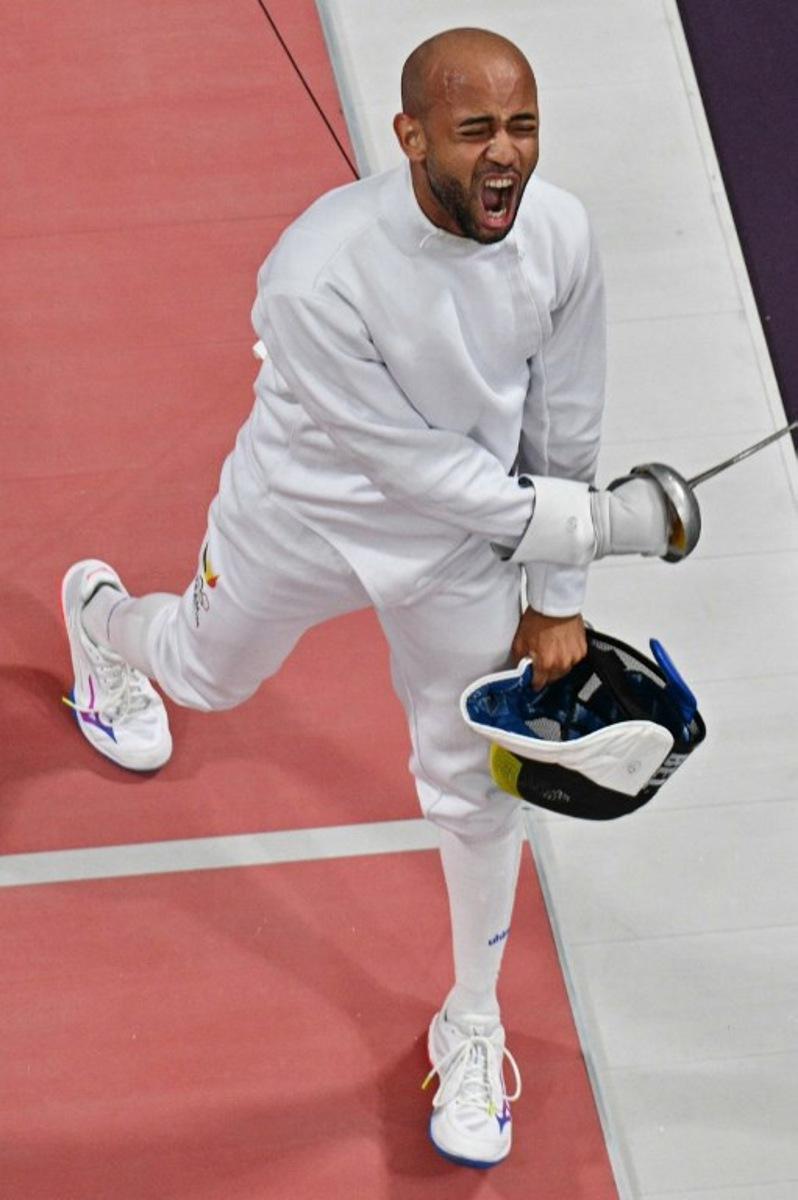 An overview shows Belgium's Neisser Loyola (L) reacting as he competes against Hungary's Gergely Siklosi in the men's epee individual round of 16 bout during the Paris 2024 Olympic Games at the Grand Palais in Paris, on July 28, 2024. Jewel SAMAD / AFP
