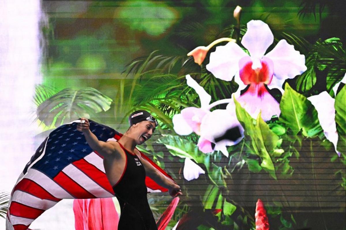 US' swimmer Gretchen Walsh celebrates winning the final of the women's 50m butterfly swimming event during the 2025 World Aquatics Championships in Singapore on August 2, 2025. MANAN VATSYAYANA / AFP
