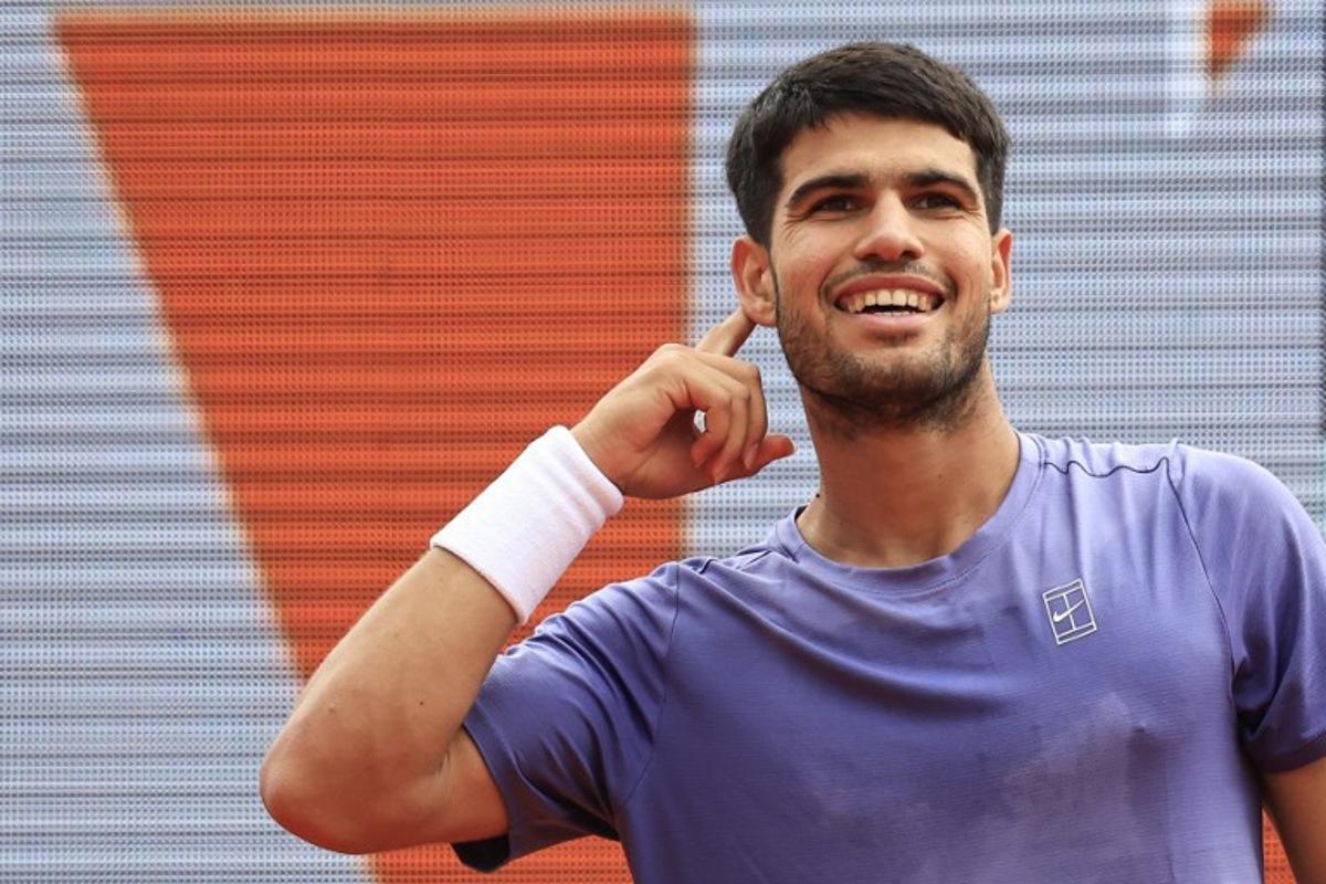 Spain's Carlos Alcaraz reacts after a point as he plays against Italy's Lorenzo Musetti during the Monte Carlo ATP Masters Series Tournament final tennis match at the Monte Carlo Country Club in Roquebrune-Cap-Martin on April 13, 2025. Valery HACHE / AFP