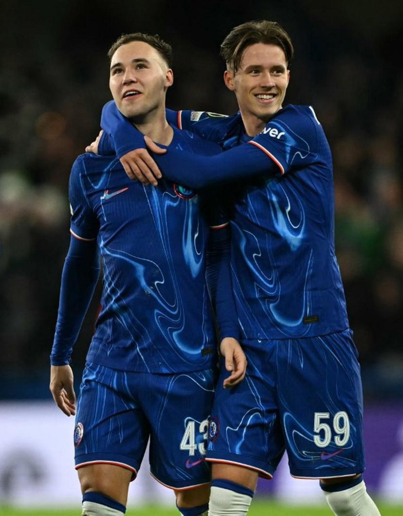 Chelsea's Harvey Vale (L) and Chelsea's Harrison Murray-Campbell celebrate after the UEFA Europa Conference League football match between Chelsea and Shamrock Rovers at Stamford Bridge in London on December 19, 2024. Chelsea won the match 5-1. JUSTIN TALLIS / AFP
