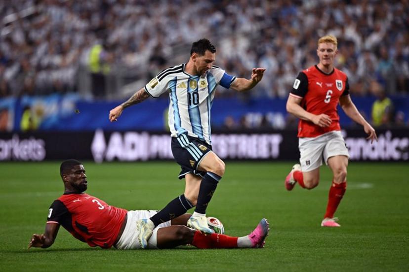 Argentina's forward #10 Lionel Messi (R) fights for the ball with Austria's defender #03 Kevin Danso (L) during the 2026 World Cup Group J football match between Argentina and Austria at the Dallas Stadium in Arlington on June 22, 2026. Paul ELLIS / AFP