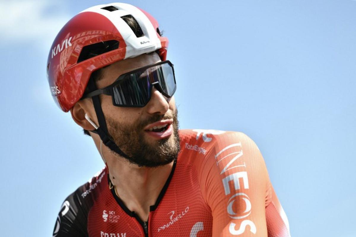 Team Ineos' Italian rider Filippo Ganna arrives to compete in the first stage of the Vuelta a Espana, a 183 km race between Torino - Reggia di Venaria and Novara, in Italy's Piemonte region, on August 23, 2025. Marco BERTORELLO / AFP