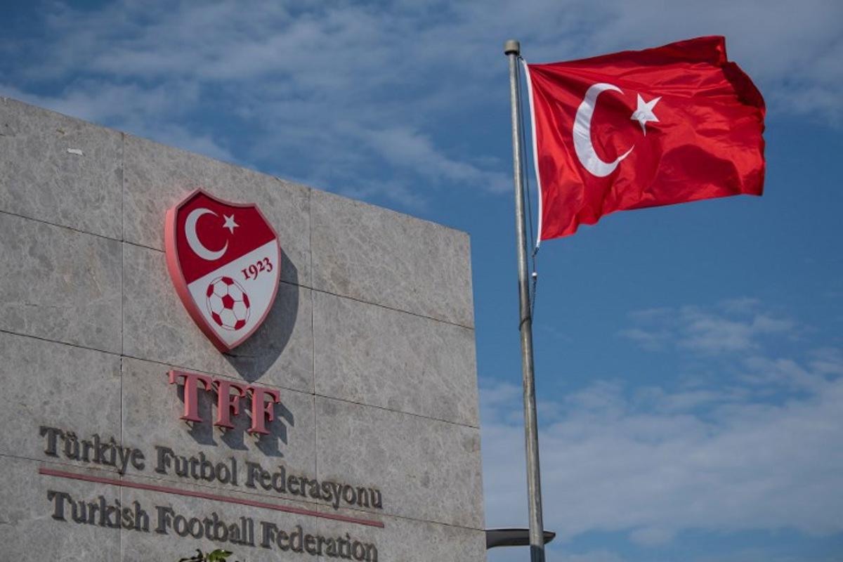 (FILES) This picture taken on May 6, 2020 in Istanbul shows a logo of Turkish Football Federation (TFF) at the entrance of the organization's headquarters. The head of Turkey's football refereeing body and six others were to appear in court on October 2, 2026, three days after being detained as part of a graft investigation, media reports said. Ferhat Gundogdu and his vice-president were detained alongside five others on Tuesday as part of a probe into allegations of top-level manipulation of the referee administration process. Ozan KOSE / AFP