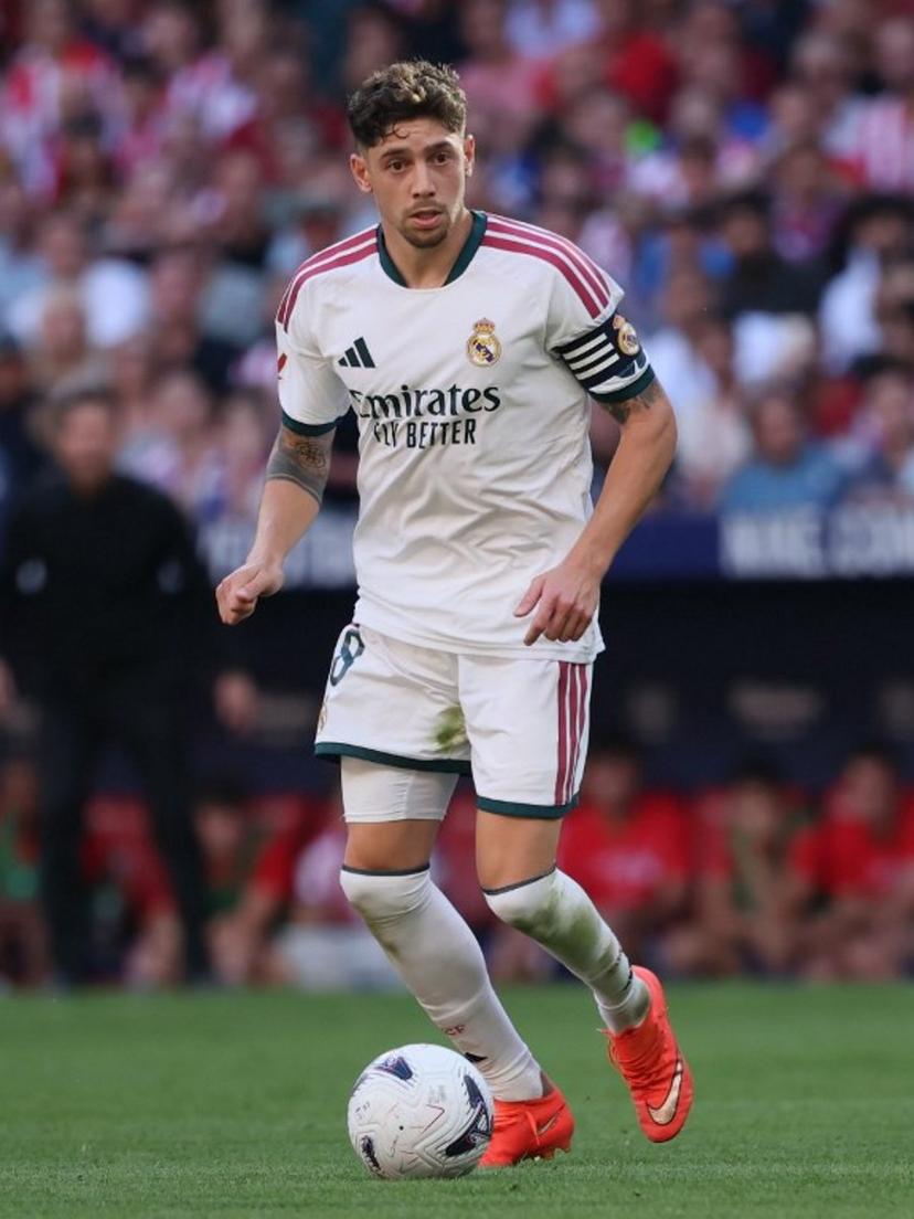 Real Madrid's Uruguayan midfielder #08 Federico Valverde runs with the ball during the Spanish league football match between Club Atletico de Madrid and Real Madrid CF at the Metropolitano stadium in Madrid on September 20, 2026. Thomas COEX / AFP