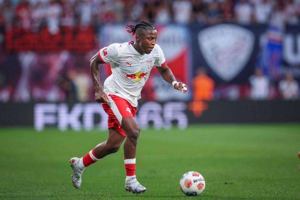 Leipzig's Belgian forward #09 Johan Bakayoko plays the ball during the German first division Bundesliga football match RB Leipzig v FC Cologne v in Leipzig, eastern Germany on September 20, 2025. Ronny Hartmann / AFP