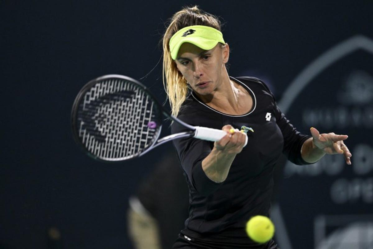 Ukraine's Lesia Tsurenko hits a return against Russia's Liudmila Samsonova during the women's singles match at the Mubadala Abu Dhabi Open tennis tournament in Abu Dhabi on February 6, 2024. RYAN LIM / AFP