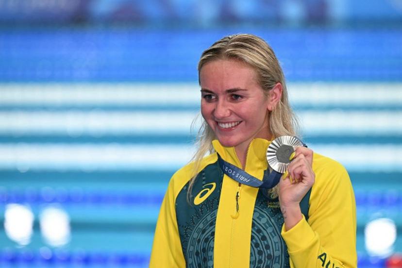 Silver medallist Australia's Ariarne Titmus celebrates during the podium ceremony of the women's 800m freestyle swimming event during the Paris 2024 Olympic Games at the Paris La Defense Arena in Nanterre, west of Paris, on August 3, 2024. Jonathan NACKSTRAND / AFP
