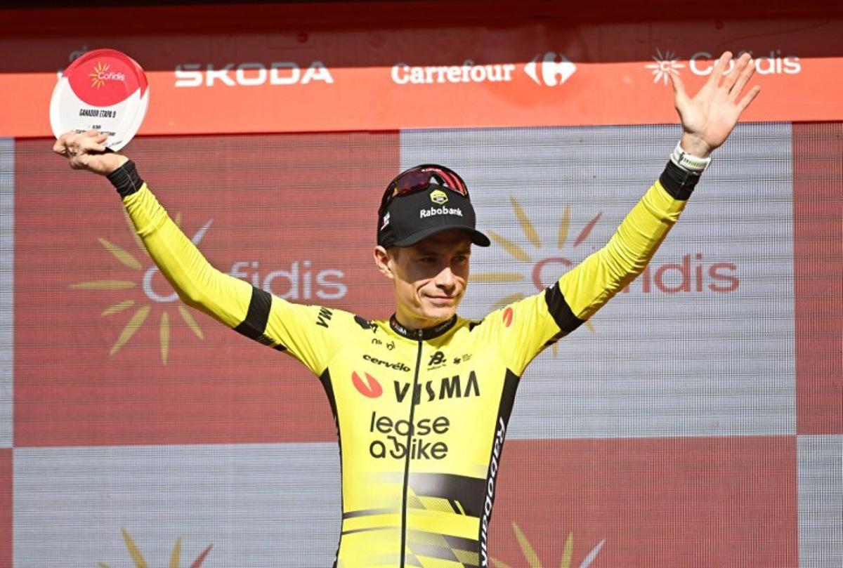 Team Visma-Lease a bike's Danish rider Jonas Vingegaard celebrates on stage after winning the 9th stage of the Vuelta a Espana, a 195 km race between Alfaro and Valdezcaray, on August 31, 2025. ANDER GILLENEA / AFP