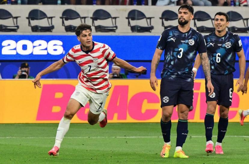 US midfielder #07 Giovanni Reyna celebrates scoring his team's fourth goal during the 2026 World Cup Group D football match between USA and Paraguay at the Los Angeles Stadium in Inglewood on June 12, 2026. Frederic J. BROWN / AFP