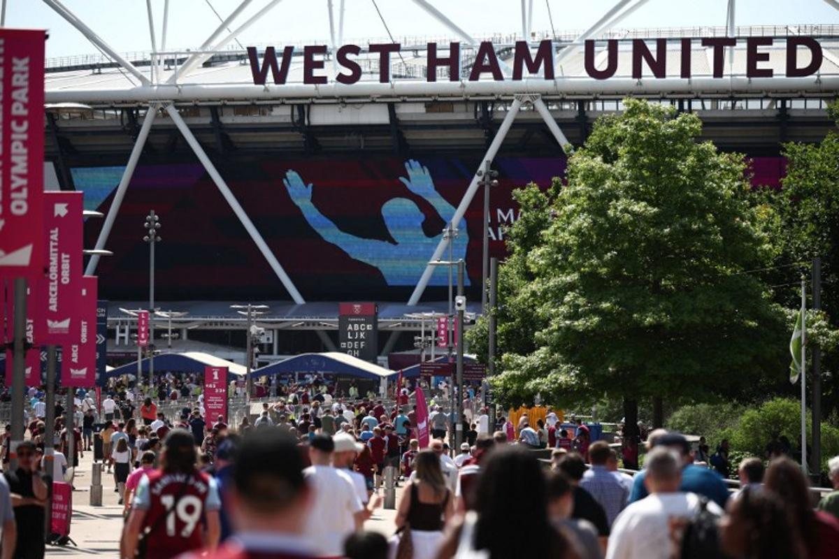 West Ham fans arrive for the English Premier League football match between West Ham United and Leeds United at the London Stadium, in east London on May 24, 2026. Henry Nicholls / AFP