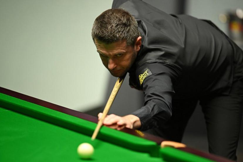 England's Mark Selby plays a shot against Belgium's Luca Brecel during the afternoon session on day two of their World Championship Snooker final match at The Crucible in Sheffield, northern England on May 1, 2023. Oli SCARFF / AFP