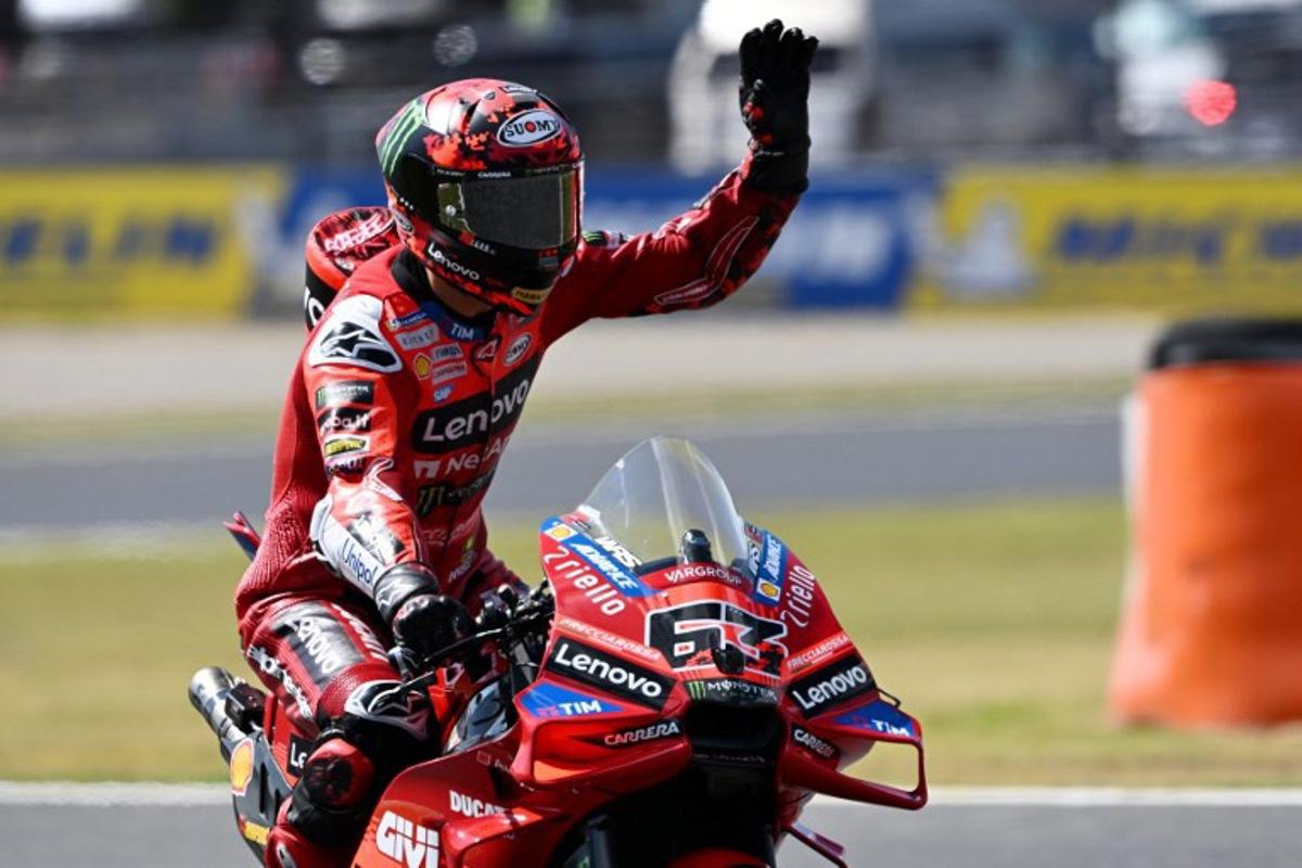 Ducati Lenovo Team rider Francesco Bagnaia of Italy waves to fans during the MotoGP class practice session of the Japanese MotoGP Grand Prix at Mobility Resort Motegi in Motegi, Tochigi prefecture on September 27, 2025. Toshifumi KITAMURA / AFP