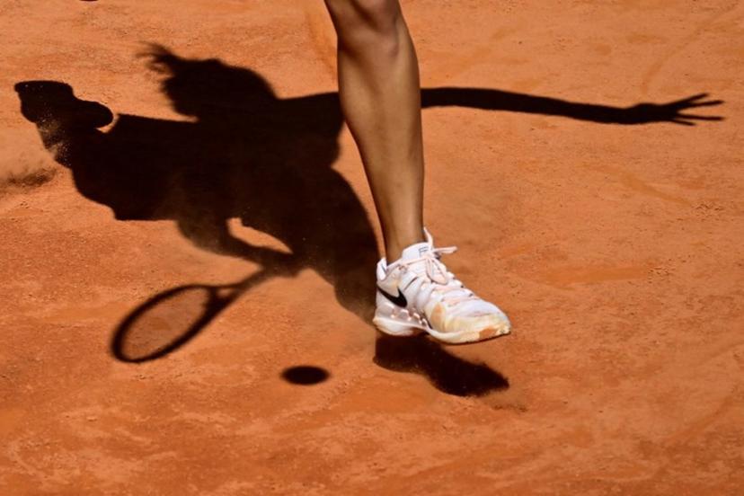 Picture of the shadow of China's Qinwen Zheng during her match against Czech Republic's Linda Noskova at the Women's WTA Rome Open tennis tournament at Foro Italico in Rome on May 11, 2024. Tiziana FABI / AFP