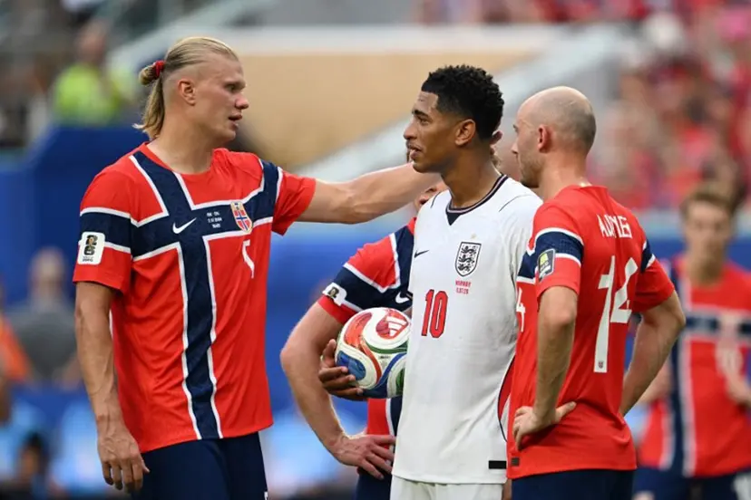 Norway's forward #09 Erling Braut Haaland (L) congratulates England's midfielder #10 Jude Bellingham (C) as Norway's midfielder #14 Fredrik Aursnes looks on, after Bellingham scored his team's second goal during the 2026 World Cup football tournament quarter-final match between Norway and England at Miami Stadium in Miami on July 11, 2026. ROBERTO SCHMIDT / AFP